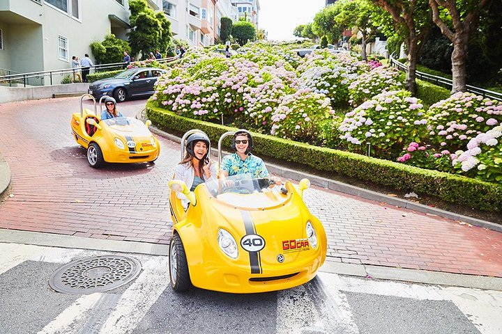 Explore the winding streets of San Francisco in a fun GPS-guided car that narrates the city's hidden gems creating unforgettable memories as you navigate its iconic landmarks.